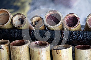 Burned sticky rice with sweet coconut milk in bamboo shot, Khao Lam is Thai dessert.