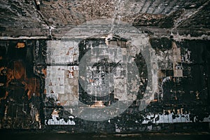 Burned underground pedestrian crossing after a fire or terrorist attack, walls in soot and smoke