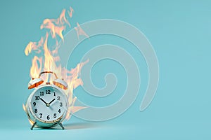 Burning alarm clock. Time out or deadline pressure concept. Clock on fire, symbol of hot sale, discounts, shopping time, countdown