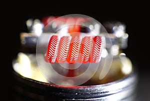 Burning alien coil build on vaping rebuildable dripping atomizer