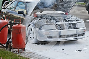 Burning automobile after extinguishing a fire at city street