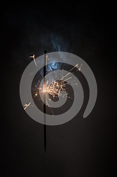 Burning bengal fire stick New year sparkler candle isolated on black background. Realistic sparkler. Magic light stick. Christmas