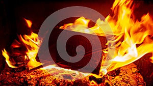 Burning black square board with open red fire flame