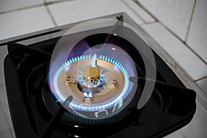 Burning blue flames from a kitchen gas stove