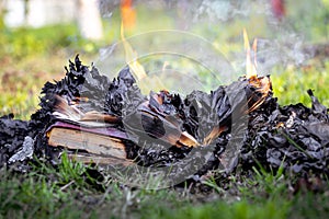 Burning books. Books burn on the fire among the ashes photo