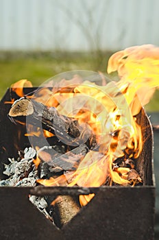 Burning brazier with firewood/burning brazier with firewood, selective focus