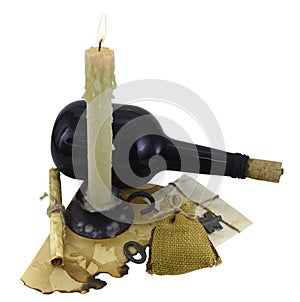 Burning candle with bottle, scroll and key