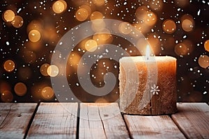 Burning candle, Christmas decoration on wooden background in falling snow and defocused lights background. Copy space