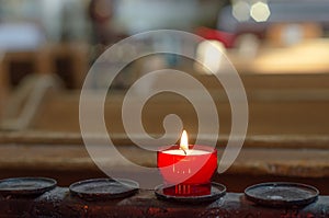 Burning candle in a church