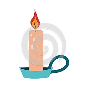 Burning candle in a flat candlestick with handle