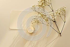 Burning candle , flower twig and card copy space for your text message. Light and shadows minimalism style template horizontal