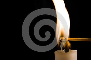 Burning Candle with Match