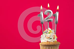 Burning candle number 121 - Birthday card with cupcake