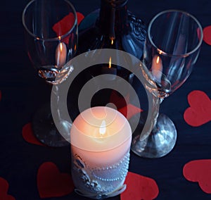 Burning candle, romantic atmosphere. On a wooden board. Valentine`s Day. Valentine