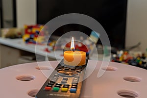 Burning candle on TV remote