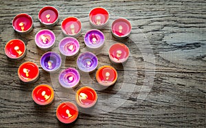 Burning candles arranged in the shape of heart