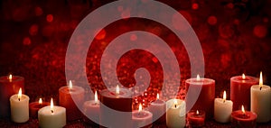 Candles on red festive background photo