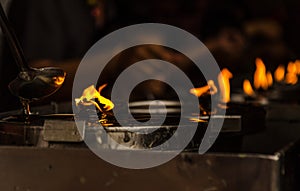 Burning candles at a Buddhist temple