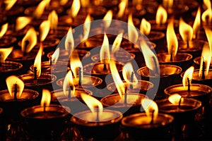 Burning candles in Buddhist temple. Dharamsala, Himachal Pradesh