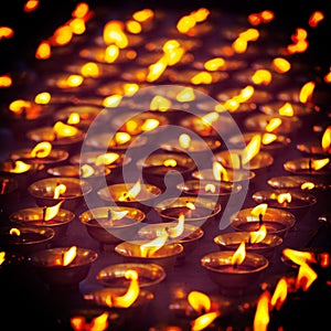 Burning candles in Buddhist temple. McLeod Ganj, Himachal Prades