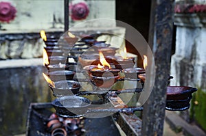 Burning candles in Buddhist temple in Sri Lanka. photo