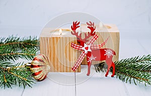 Burning candles and Christmas toys. New Year`s decor