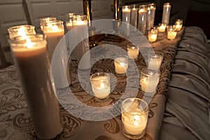 Burning candles on church altar