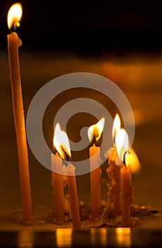 Burning candles on dark background photo