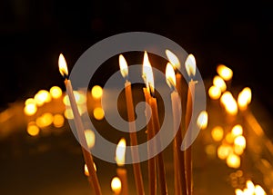 Burning candles on dark background photo