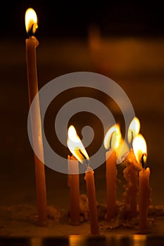 Burning candles on dark background photo