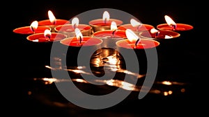 Burning candles on the dark background. Mystique atmosphere