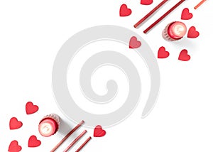 Burning candles, heart-shaped shapes and wooden sticks are on a white background. Valentine`s Day background. Flat lay. Top view.