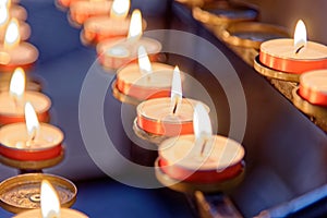 Burning candles inside Winchester Cathedral, Hampshire, England