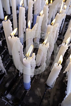 Burning candles in lourdes