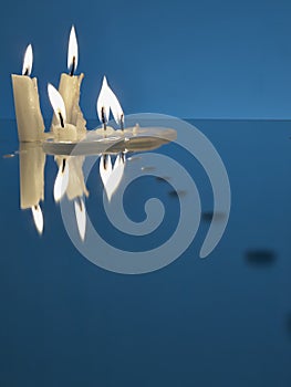 Burning candles on a miror