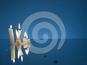 Burning candles on a miror