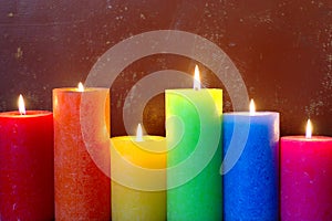 Burning Candles In Rainbow Colors