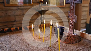 Burning candles. Religious memorial attribute of warmth and sincerity. Full shot.