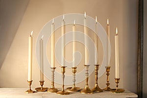 Burning candles in retro candlesticks indoor