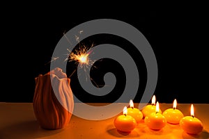 Burning candles on a white background next to the fireworks. Obon festival. Diwali festival