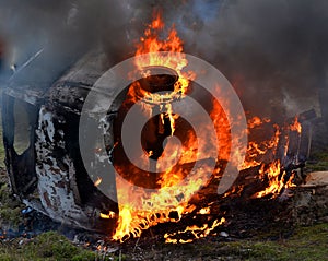 Burning car closeup photo