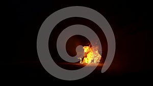 Burning car door isolated on a black background in smoke