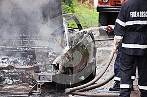 Burning Car. Totally burned car action. photo