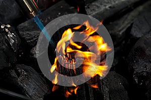 Burning charcoal close up. Coal lump on gas flame