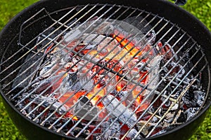 burning charcoal grill