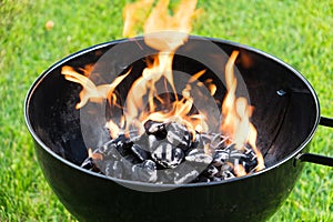 Burning Charcoal in a Grill photo