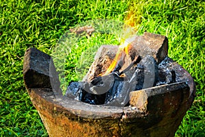 Burning charcoal in old stove