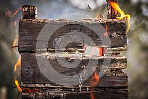 Burning charred wood billboard