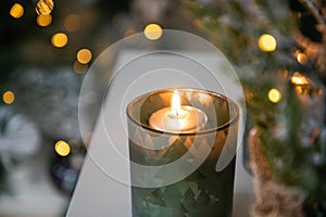 burning Christmas candles and bokeh light