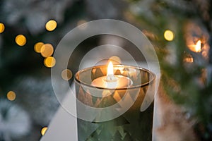 burning Christmas candles and bokeh light
